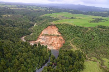 Figure 7: Photo of a large landslide that blocked Kaukaumoutiti Stream, northwest of Tauranga, with a small lake impounded upstream. Sam McColl, GNS Science 