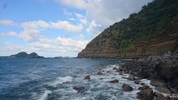 Cliffs that surround Fishing Rock at Raoul Island.