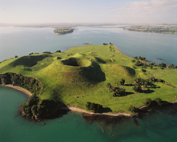 Aerial view of Motukorea (Browns Island) showing the scoria cone, tuff ring and lava flows. (GNS VML 10704)