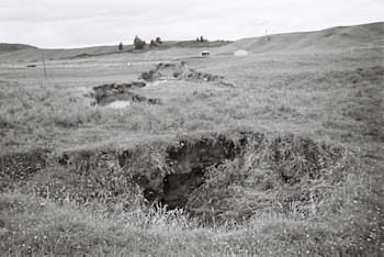 View of 1967 collapse holes (tomo) looking east across Earthquake Flat