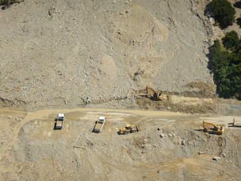 A big mess, once again. SH1 closure north of Paparoa Point.