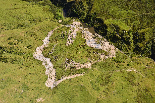 Large landslide in the Puketoi Range foothills, showing dammed lake at the toe of the slip.