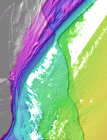 The Papatea Fault where it heads offshore – the grey, pink and purple are above sea level, and the turquoise and green are below. Source: NZTA/NIWA.