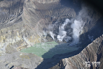 Aerial view of the crater lake and active vents at Whakaari/White Island, 18 July 2023. 