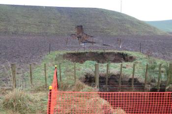 Collapse holes on west side of SH 5, note the pipe developing into the ridge
