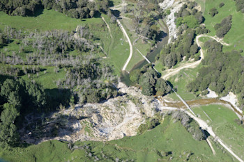 Part of Te Arai landslide that failed showing blocked river and water supply pipeline