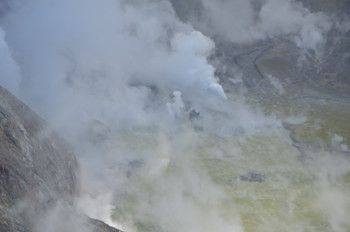 Figure 2: View into crater of Whakaari/White Island, 24 March 2024 showing geysering, ejecting steam and dark material. Photograph credit: Brad Scott, GNS Science. 