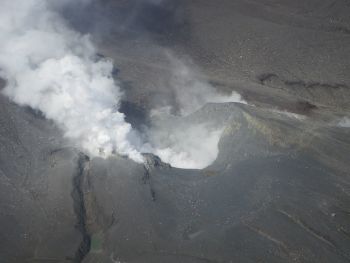 Picture of Upper Te Maari Crater looking south west. The main Upper Te Maari Crater is in the centre with the main gas discharge area to the left (east) at the head of the prominent fissure running to the base of the pic
